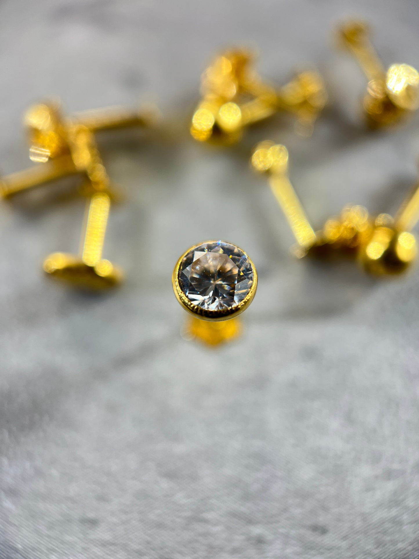 Gold Solitaire White Gemstone Stud