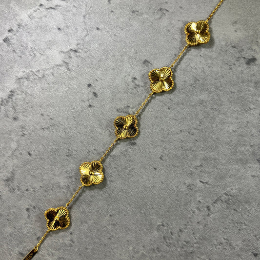 22ct yellow gold clover bracelet showing rich, deep gold colour