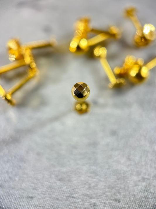 Gold faceted sphere stud earring