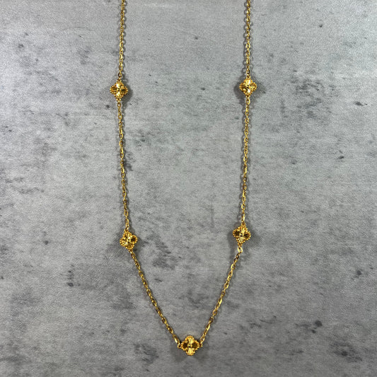 Pictured, our exquisite 22ct Yellow Gold Hallmarked Clover Necklace—a symbol of luck and beauty. This necklace features 5 delicately crafted clover designs with flower motifs and a secure Lobster Clasp. With a highly polished finish, it radiates elegance. Length: 18" (45.7cm). Also available in 3, 5, & 10 Clovers in different lengths. Elevate your style with this timeless and versatile gold necklace today.