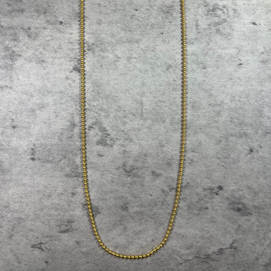 Pictured, our 22ct Yellow Gold Hallmarked Small Ball Chain—a symbol of simplicity and elegance. With connecting balls along the chain and a highly polished finish, this piece radiates sophistication. Length: 18" (45.7cm). Available in various lengths—just get in touch. Each chain comes with packaging, making it a perfect gift choice. Elevate your style with this beautifully crafted gold chain today.