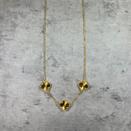 Our elegant 22ct Yellow Gold Hallmarked Clover Necklace—an exquisite and popular piece. This necklace features 3 charming clover designs, each adorned with a flower motif and a secure Lobster Clasp. With a highly polished finish, it radiates timeless allure. Length: 18" (45.7cm). Also available in 3, 5, & 10 Clovers in different lengths. Elevate your style with this versatile and finely crafted gold necklace today.