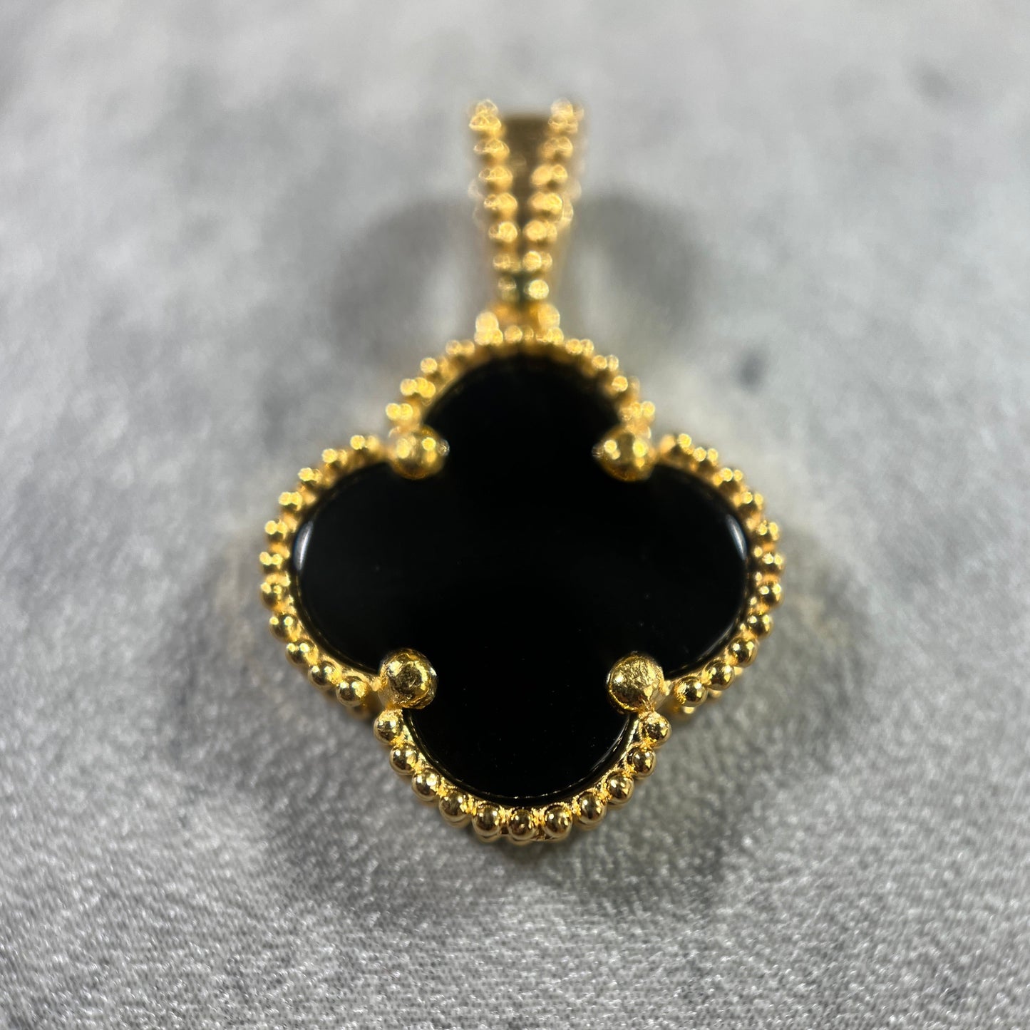 Handcrafted black clover pendant, symbolising luck and nature, available now.