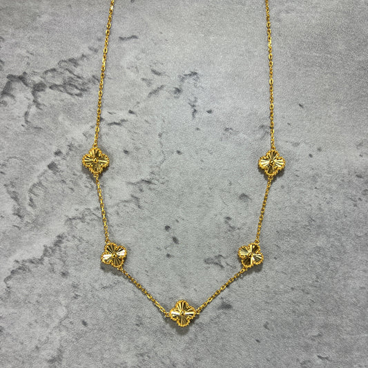 A 5 clover necklace in 22ct yellow gold hallmarked. The design of the necklace is of a 4 petal flower or a clover, and the clasp of the bracelet is a lobster clasp. Length of necklace is 18 inches. The item is ready for purchase, and is perfect as a treat for oneself, a gift for a family or friend! This is a statement piece, can be worn on its own or stacked alongside other necklaces. 